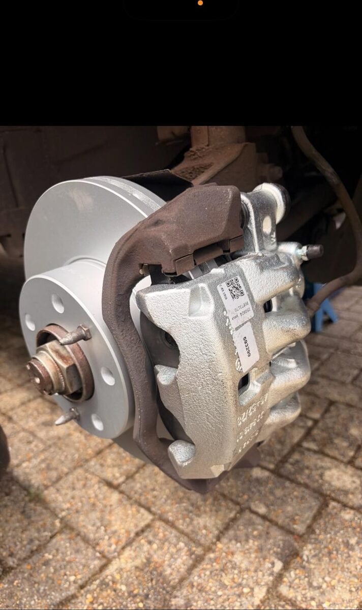 New brake disc and refurbished caliper fitted to a rear hub