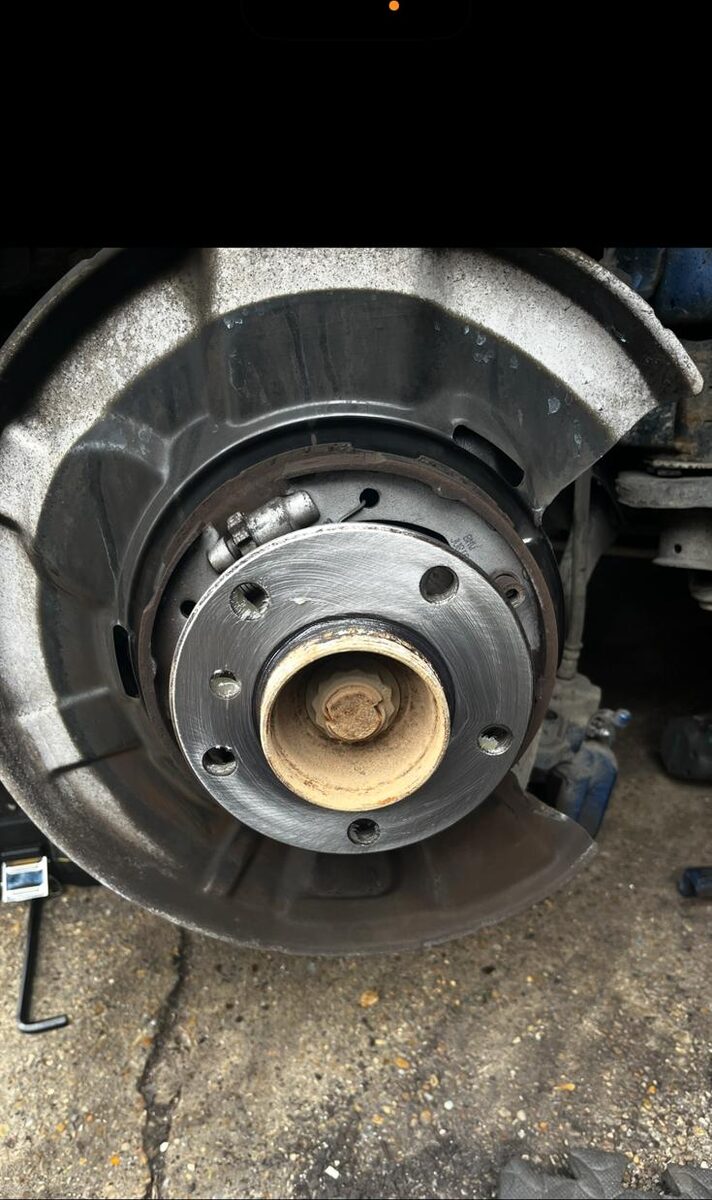 Rear brake assembly with disc removed showing hub and shoes