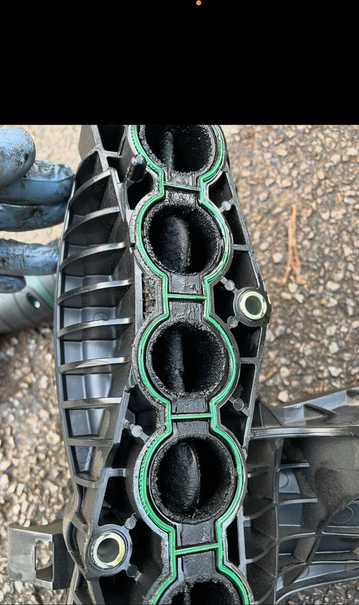 Inlet manifold removed showing carbon in the runners